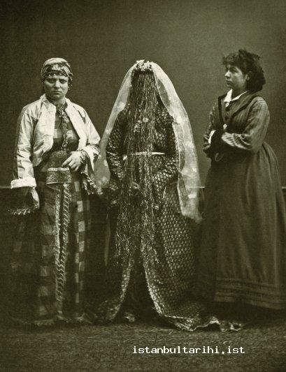 23- An Armenian woman in bridal dress between a Greek and a Jewish woman (<em>Elbise-i Osmaniye</em>, 1873)