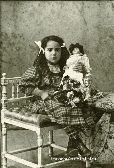 8- A girl with a doll (beginning of 20th century,   from the collection of F. Geleş)