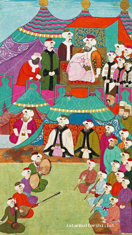 9- A music demonstration in the presence of Sultan Ahmed III: Burnaz Hasan Çelebi, the head singer (the singer with a hook nose and fur robe sitting at the beginning on the left side and directing the demonstration with his tambourine), ney, kemançe, tanbur and santur. Vehbi says, “about hundred singers and instrument players …” The miniature is a representational depiction. It is a painting of Nakkaş İbrahim (<em>Surname-i Vehbi</em>. Topkapı Palace Museum Library, A. 3594, fol. 106b)