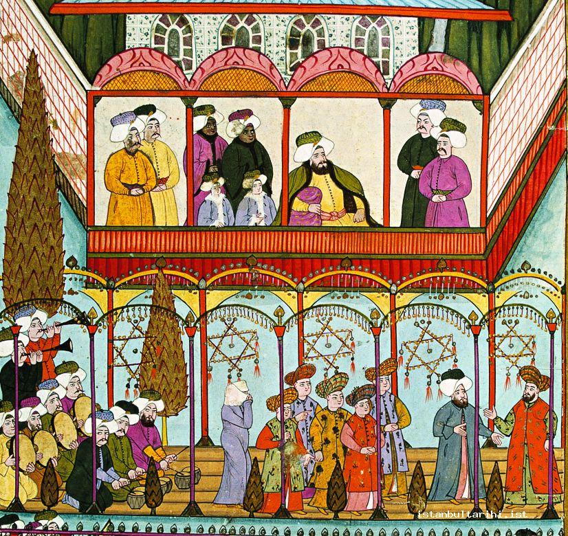 10- <em>Bahçıvaoğlu Kolu</em>’s ortaoyunu show in the presence of the sultan and his sons on a raft in front of Aynalıkavak Palace (a miniature of Levni. <em>Surname-i Vehbi</em>. Topkapı Palace Museum Library, A. 3593, fol. 90a)